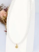 naszyjnik-perły-złota-kulka-elegancki.webp